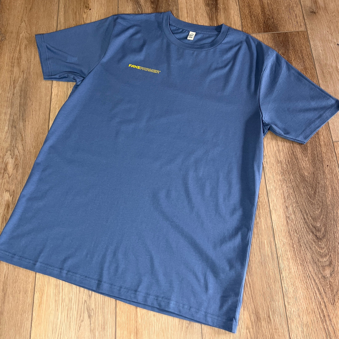 Official Fake Farmer® Unisex Eco Blue T-Shirt - Yellow Logo